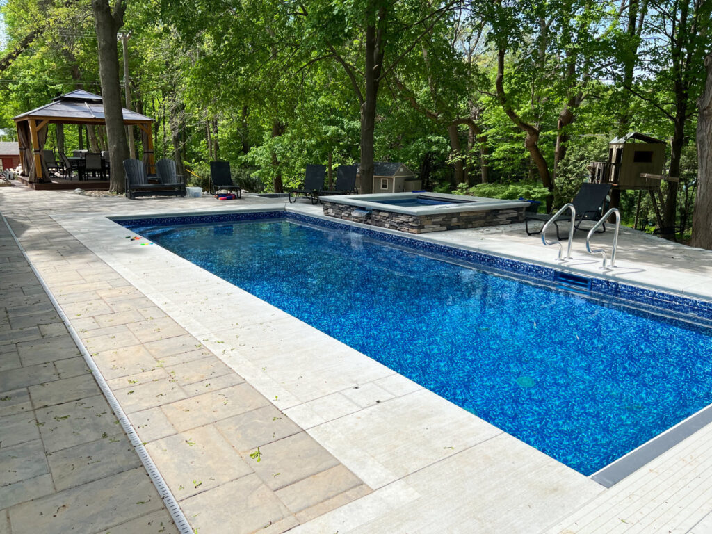 Northville_Pool_and_Spa_with_hardscape_decking_and_landscape1.jpg